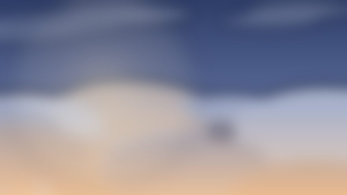 Amber dusk clouds over a deep blue sky