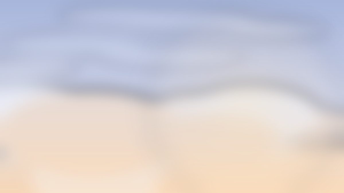 Dawn clouds opening over a warm horizon